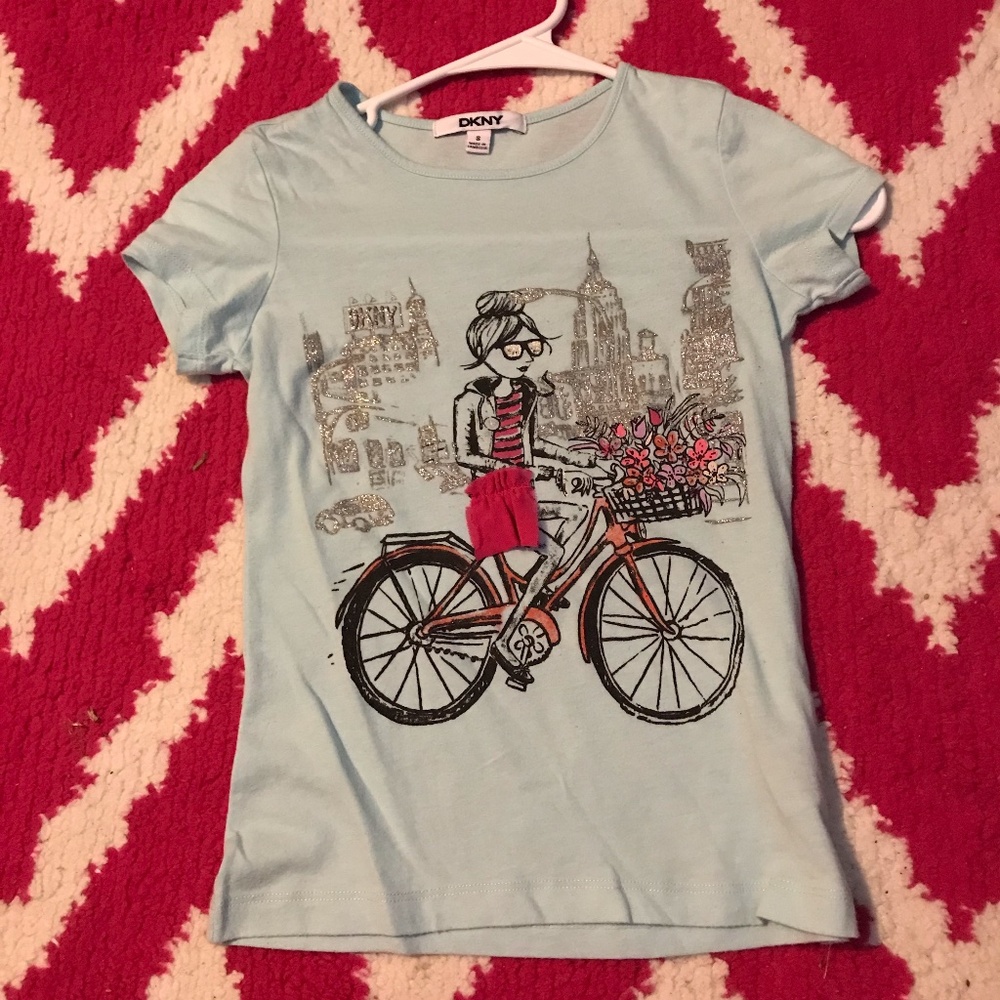 girls blue bicycle shirt